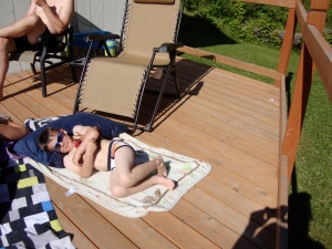 Then back to Kenai, where we had some beautiful weather.  Amy Jo was laying out on the deck during our water fight.  When the water fight was over, Justice ran in the house took off all his clothes and grabbed his blanket and pillow, just like Aunt Amy and laid in the sun.  Who would have thought!